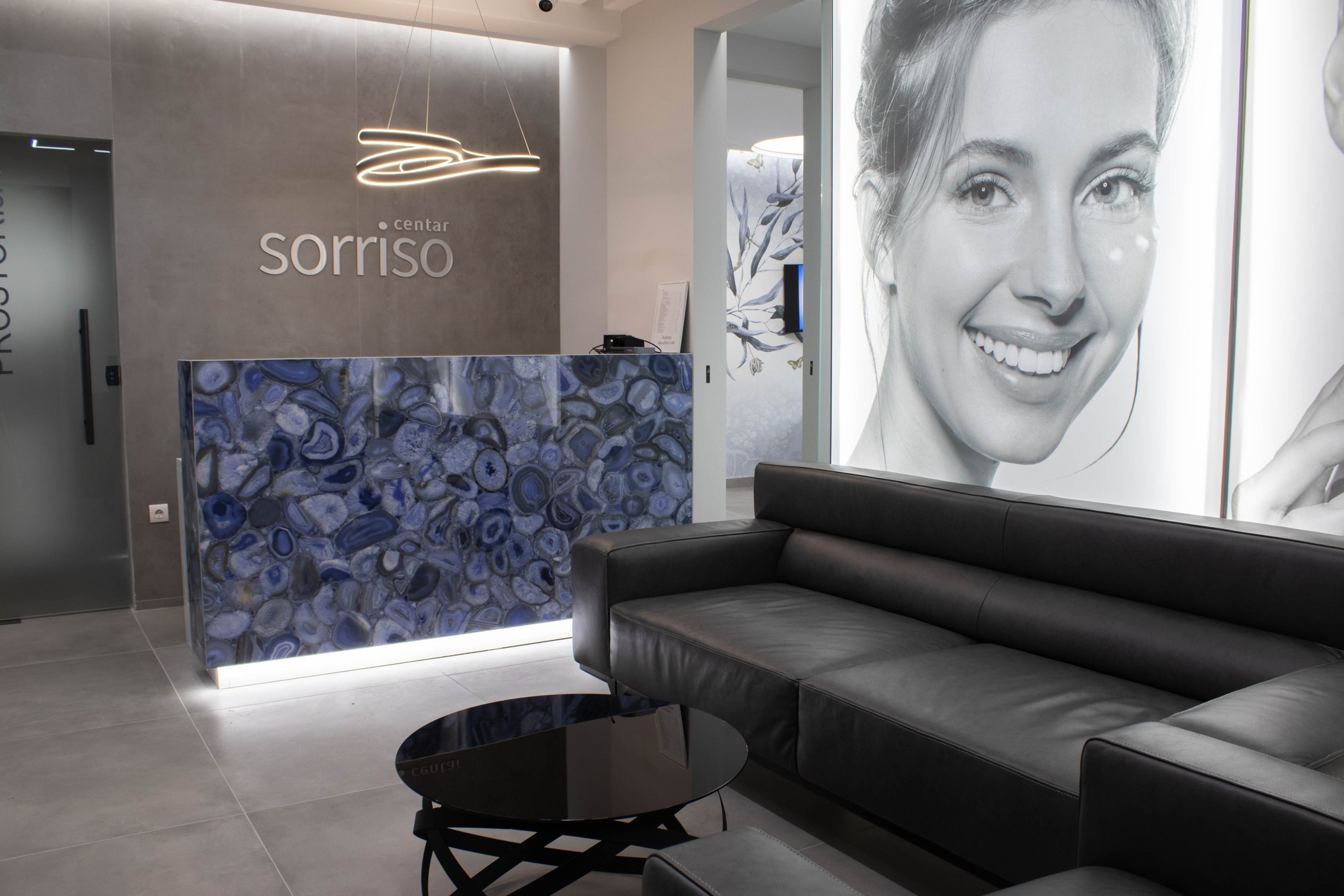 Reception area with Sorriso Centar branding and elegant design